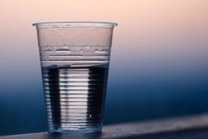 Plastic cup water sunset