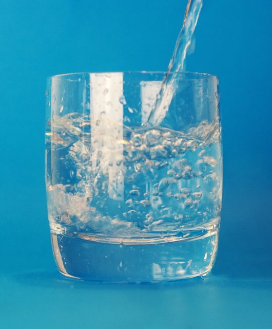Water glass blue background