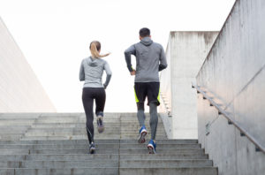 man woman run stairs exercise sports yoga pants