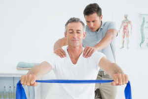 young man sports coach massage recovery old gentlemen