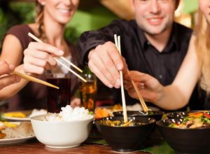group eating healthy restaurant indulge balanced diet