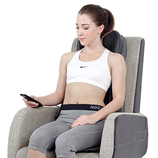 A woman sitting in Naipo's back massage chair.